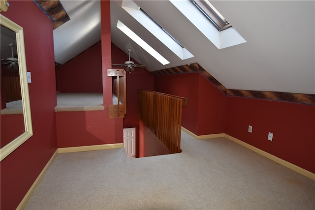 bonus room featuring lofted ceiling, ceiling fan, and light carpet