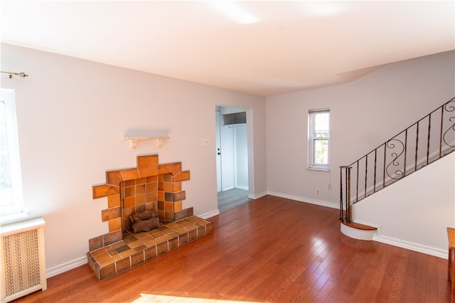 living room featuring radiator and hardwood / wood-style floors