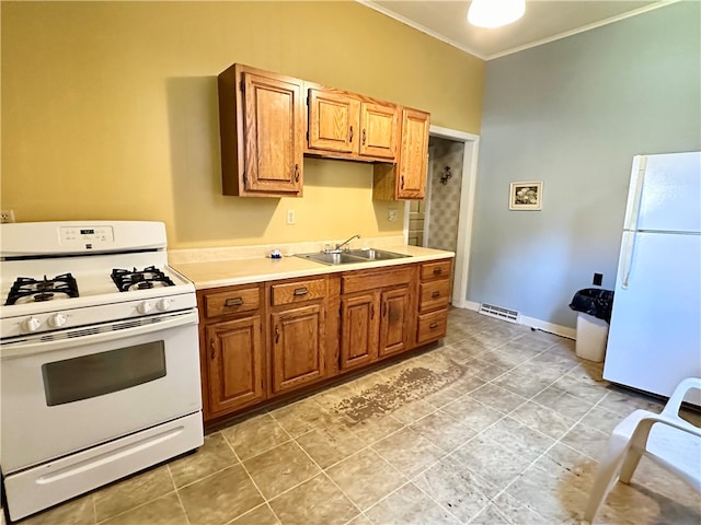 kitchen featuring ornamental molding, white appliances, sink, and light tile patterned floors