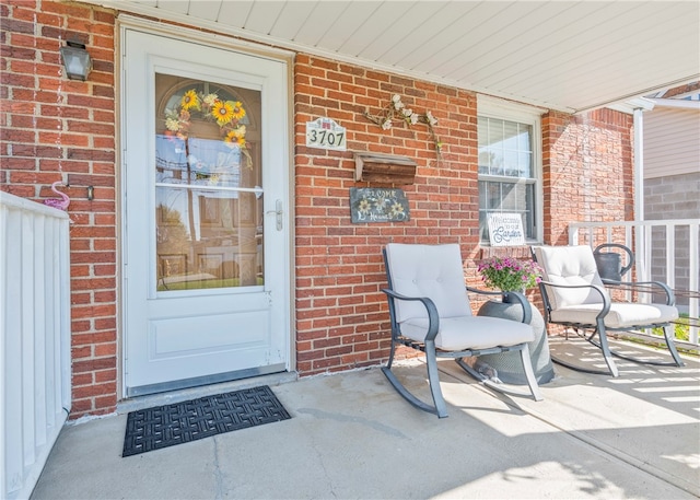 doorway to property featuring covered porch