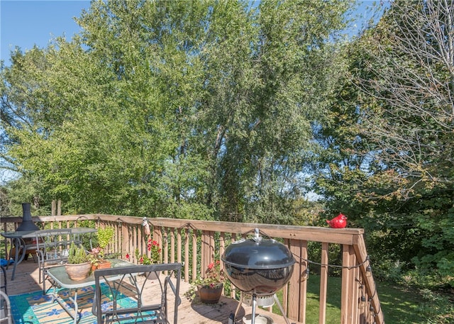 wooden terrace featuring area for grilling