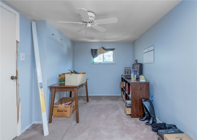 home office featuring light colored carpet and ceiling fan