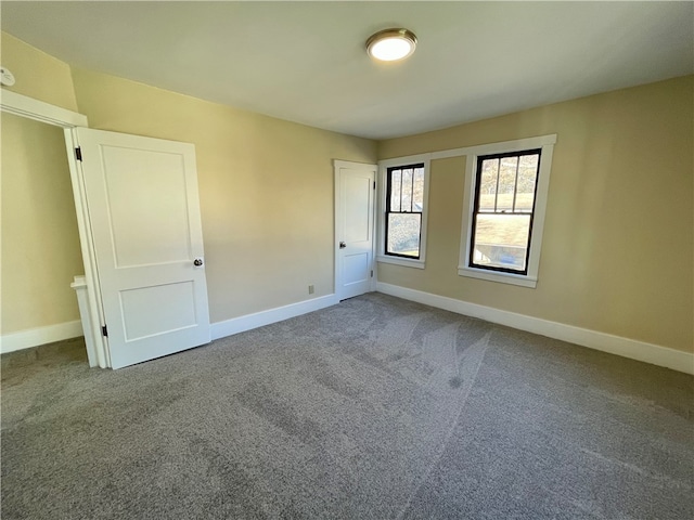 unfurnished room featuring carpet flooring