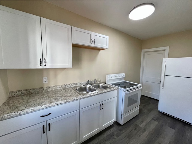 kitchen with dark hardwood / wood-style flooring, sink, white appliances, and white cabinetry