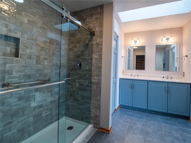 full bathroom featuring a stall shower, tile patterned flooring, and a sink