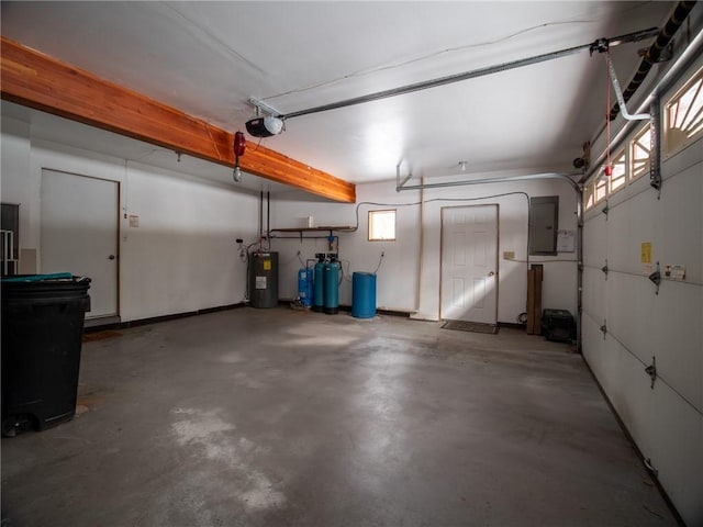 garage with a garage door opener, electric panel, and water heater