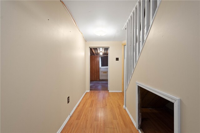 hall with light hardwood / wood-style floors