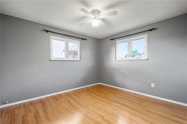 unfurnished room with light hardwood / wood-style floors and ceiling fan