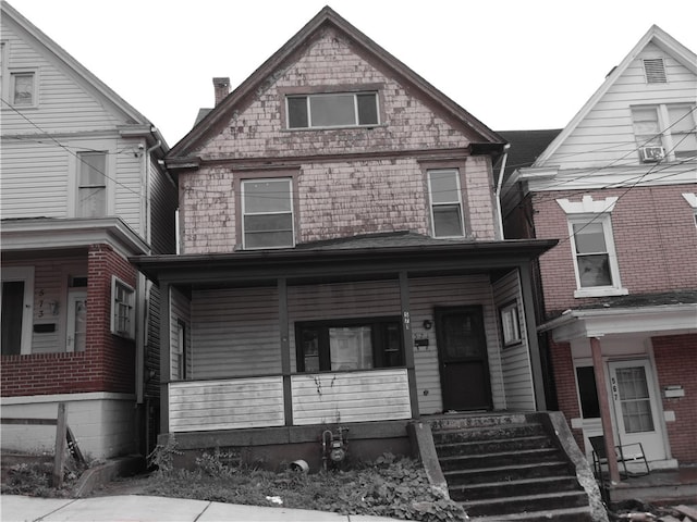 view of front of property featuring covered porch