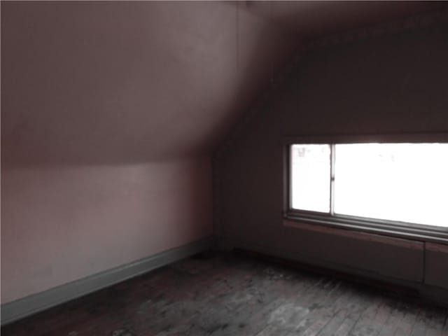 571 2nd St, Pitcairn, PA 15140 - additional living space featuring dark wood-style flooring, vaulted ceiling, and baseboards