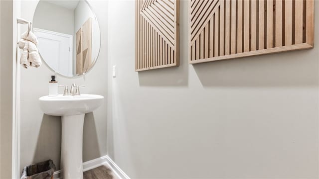 bathroom with hardwood / wood-style flooring