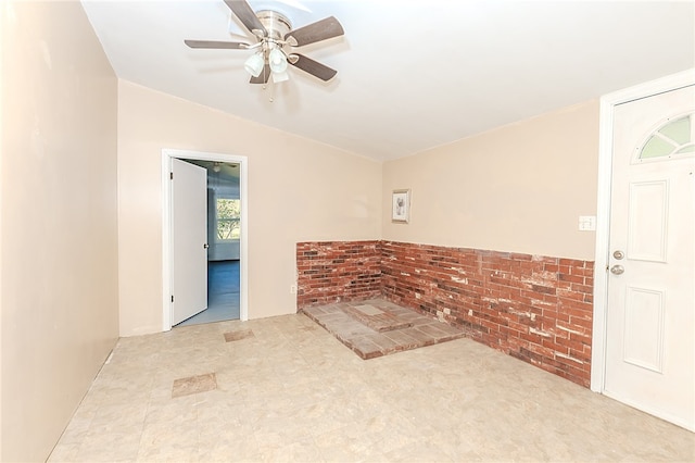 empty room with vaulted ceiling and ceiling fan