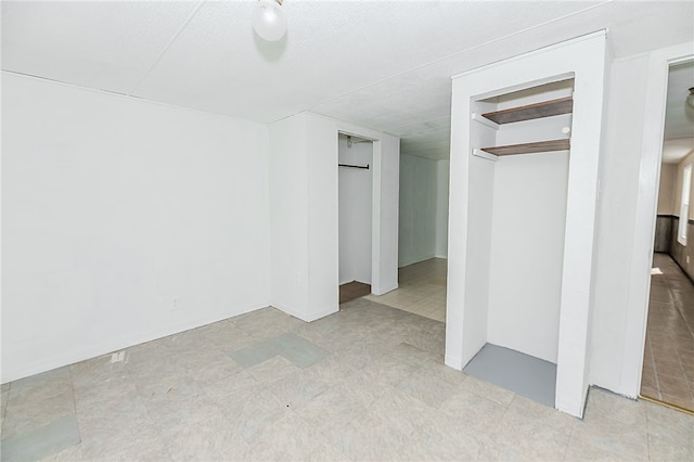 unfurnished bedroom with a closet