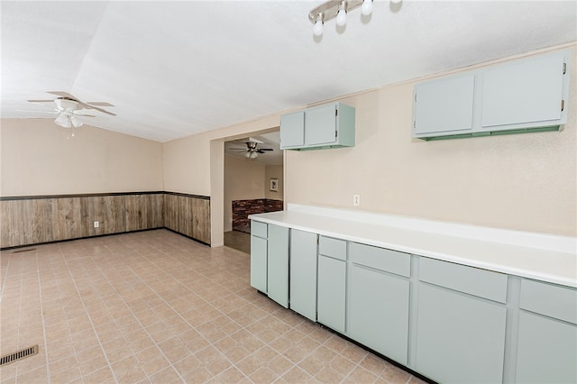 kitchen with lofted ceiling and ceiling fan