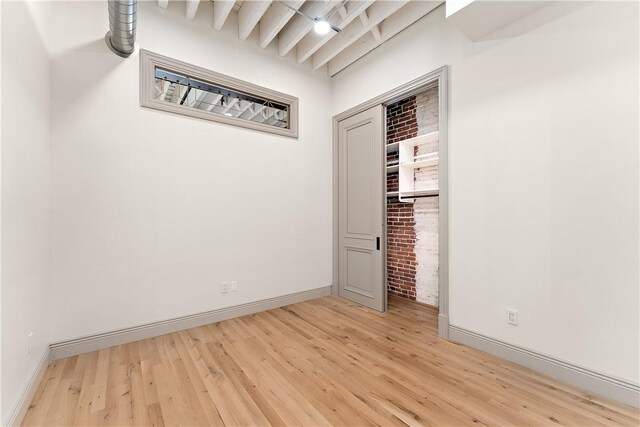 915 Liberty Ave Unit 2, Downtown Pgh, PA 15222 - spare room with light wood finished floors, baseboards, and beamed ceiling