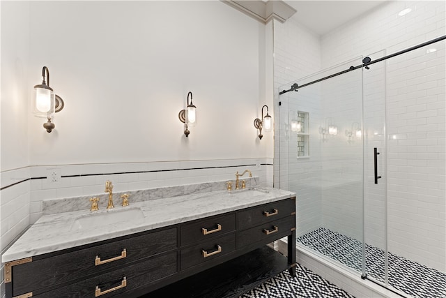 bathroom featuring vanity, tile walls, tile patterned flooring, and an enclosed shower