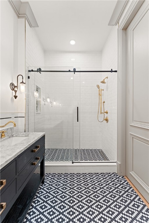 bathroom with walk in shower and vanity