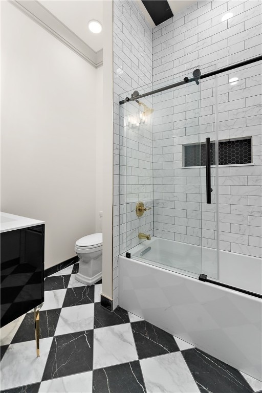 full bathroom with vanity, combined bath / shower with glass door, and toilet