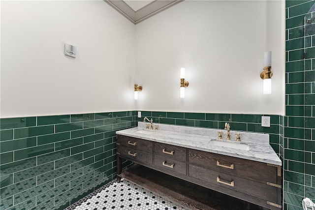 915 Liberty Ave Unit 5, Downtown Pgh, PA 15222 - bathroom featuring tile walls, double vanity, tile patterned floors, a wainscoted wall, and ornamental molding
