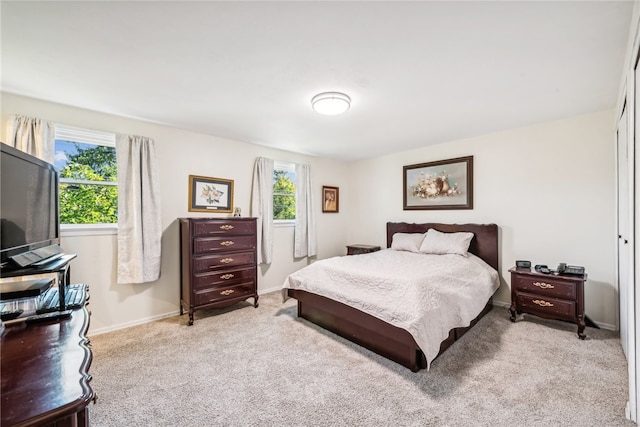 carpeted bedroom with a closet