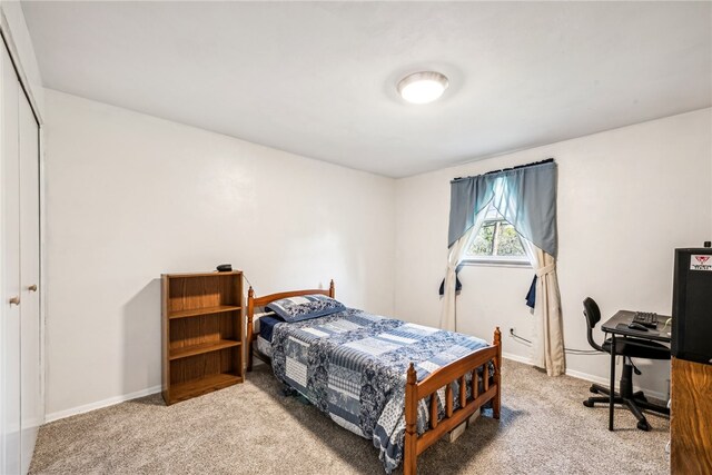 carpeted bedroom with a closet