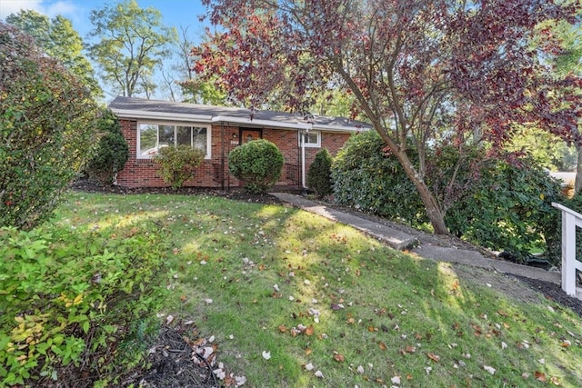 ranch-style house with a front yard