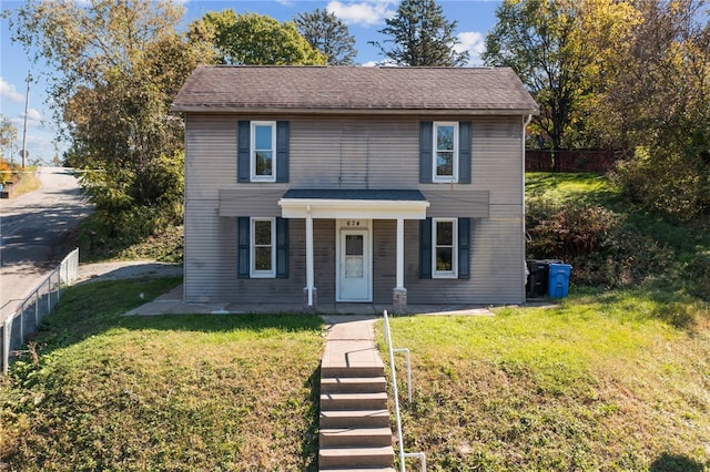 front facade with a front lawn