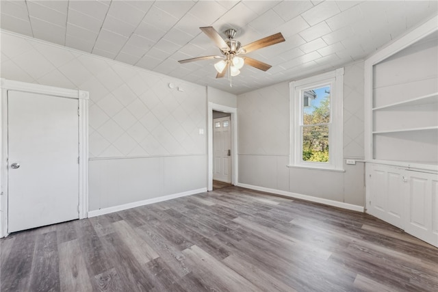 spare room with ceiling fan and hardwood / wood-style floors