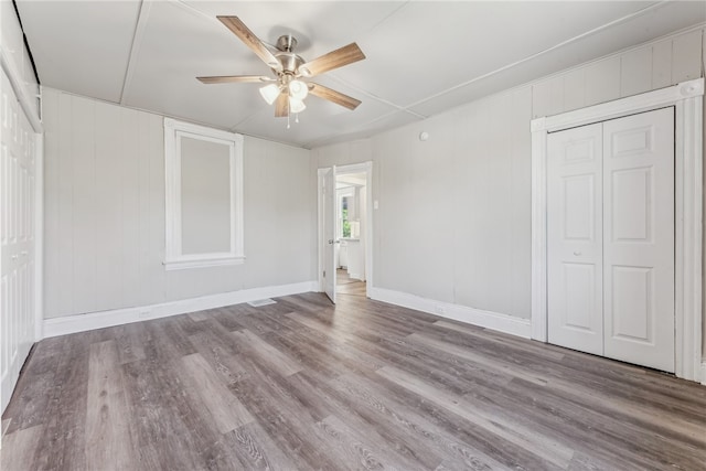 unfurnished bedroom featuring light hardwood / wood-style flooring and ceiling fan