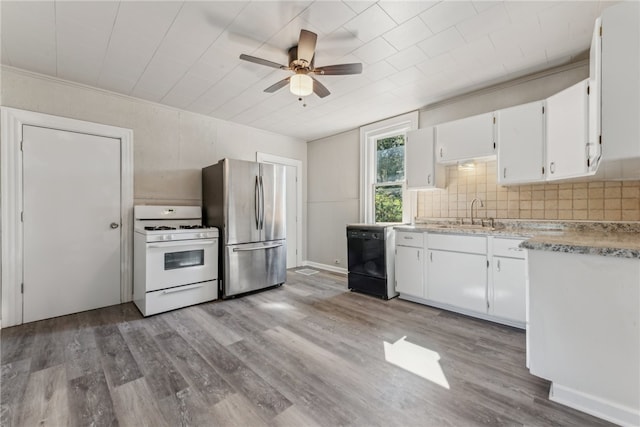 kitchen with stainless steel fridge, white cabinetry, white range with gas stovetop, black dishwasher, and light hardwood / wood-style flooring