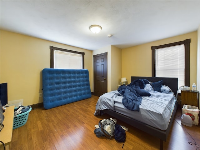 bedroom featuring a closet and hardwood / wood-style flooring