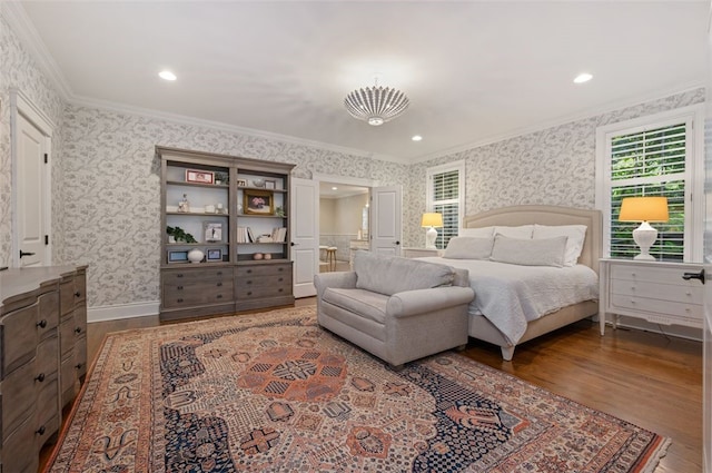 bedroom with hardwood / wood-style floors and crown molding