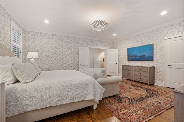 bedroom with ornamental molding, a chandelier, and hardwood / wood-style floors