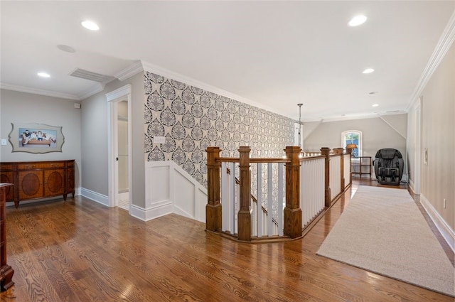 hallway featuring ornamental molding, hardwood / wood-style floors, and a notable chandelier