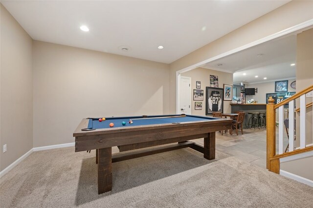 rec room featuring indoor bar, pool table, and light colored carpet