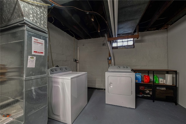 washroom with washing machine and clothes dryer