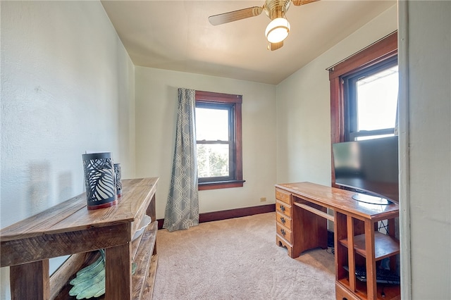 carpeted office with ceiling fan