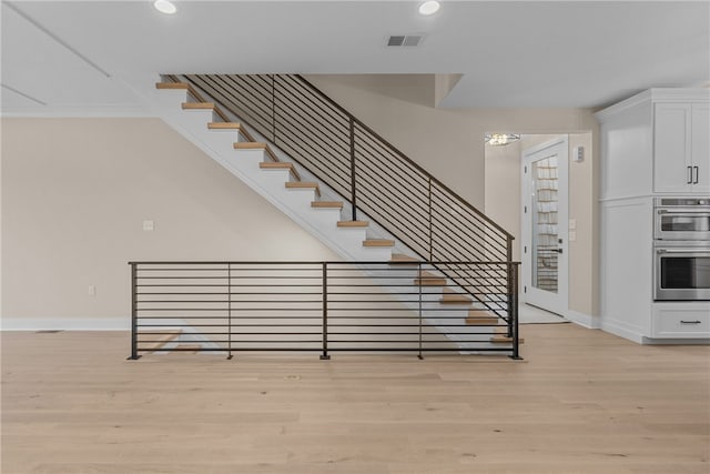 stairs with wood-type flooring