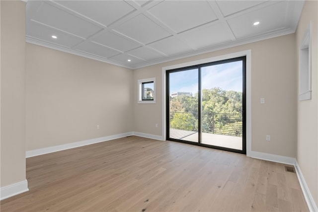 spare room featuring crown molding, coffered ceiling, and light hardwood / wood-style floors