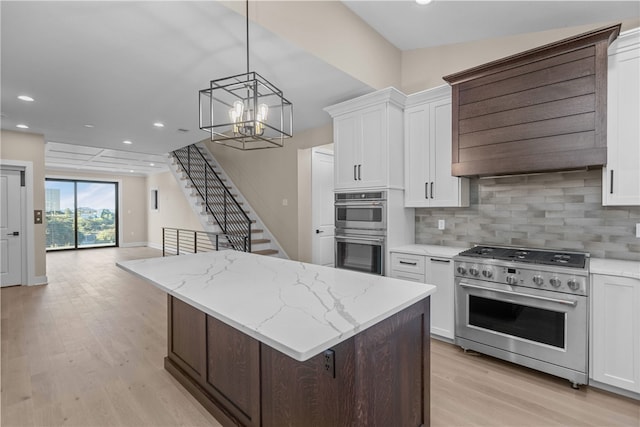 kitchen with appliances with stainless steel finishes and white cabinetry