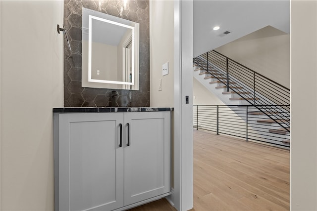 interior space featuring light hardwood / wood-style floors and white cabinets