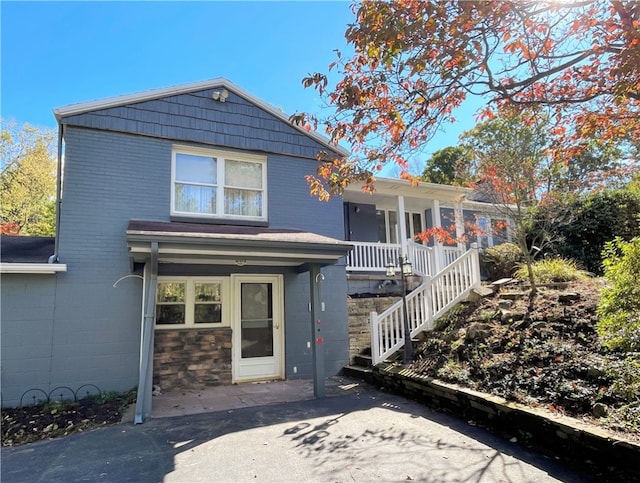 view of front of home featuring covered porch