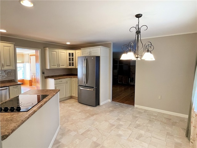 kitchen with decorative backsplash, stainless steel appliances, pendant lighting, a notable chandelier, and crown molding