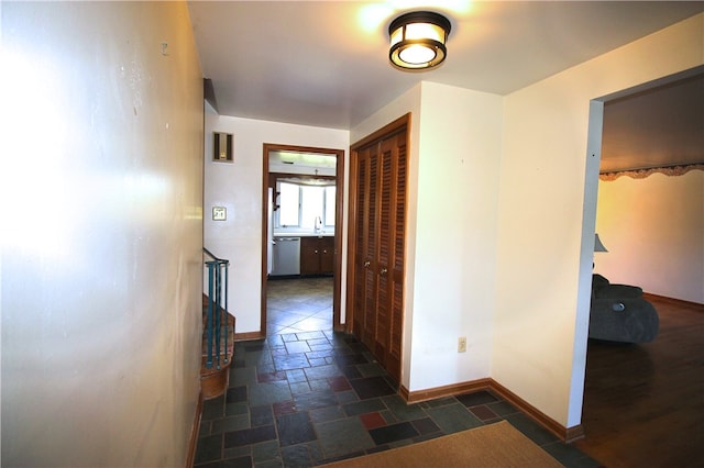 76 Broad St, West Bethlehem, PA 15345 - hall with baseboards, stone tile flooring, and a sink