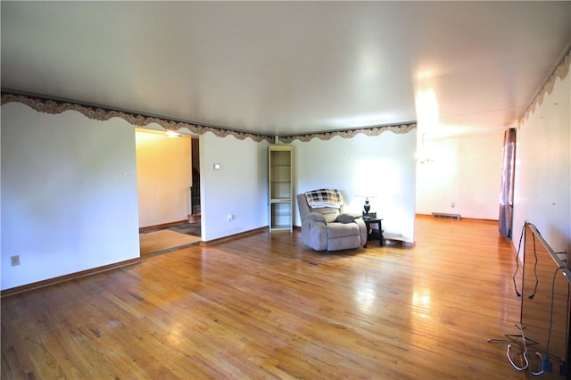 unfurnished room with wood-type flooring