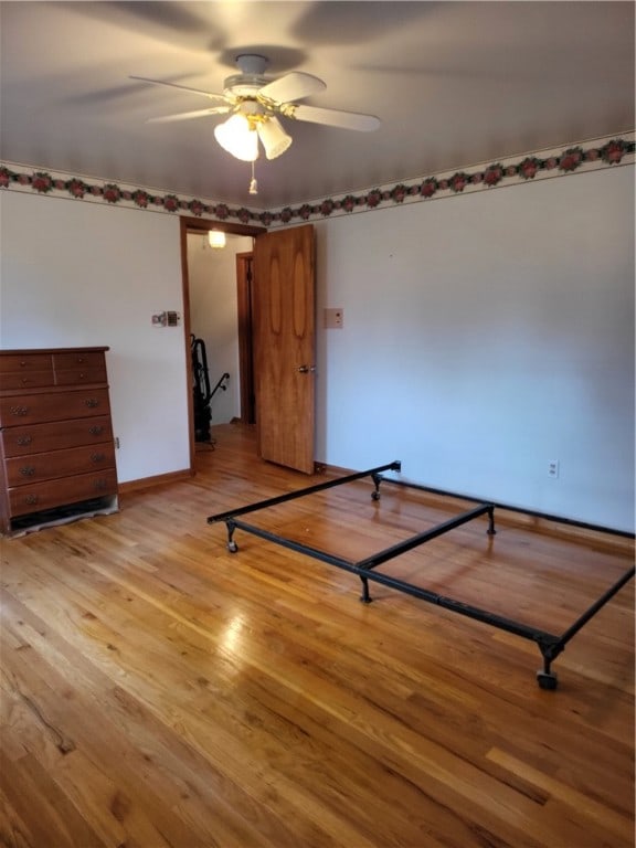 unfurnished bedroom with light hardwood / wood-style floors and ceiling fan