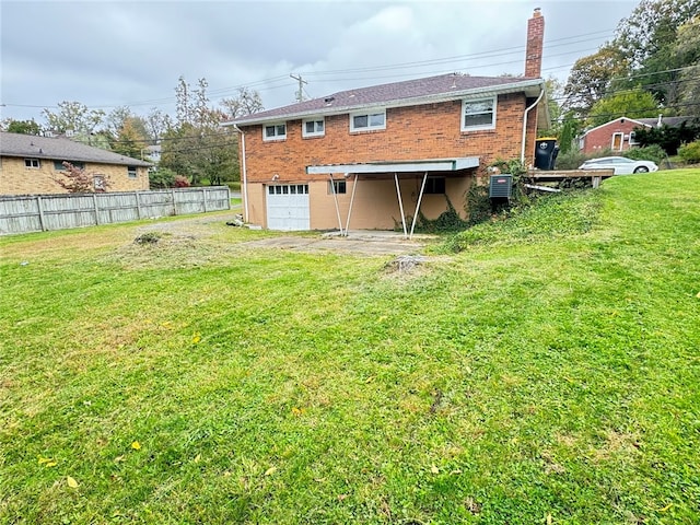 rear view of property featuring cooling unit and a lawn