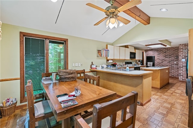 kitchen with kitchen peninsula, electric range, brick wall, and light parquet floors