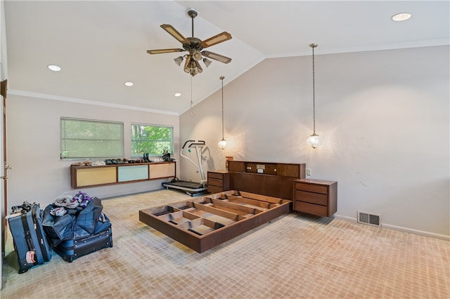 carpeted bedroom featuring ornamental molding, vaulted ceiling, and ceiling fan