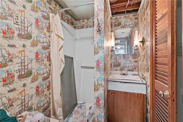 bathroom featuring shower / bath combo and vanity